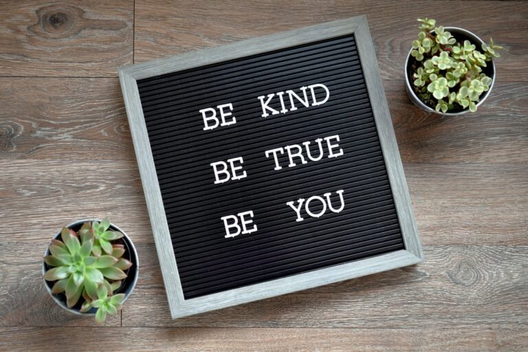 Be Kind, Be True, Be You message board sign with succulent plants