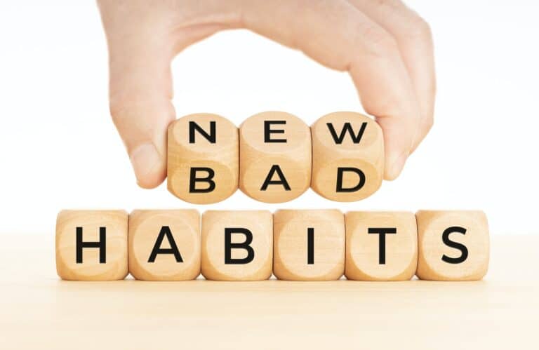 Hand Placing Wooden Letter Blocks that Spell "New" & "Bad" on Letter Blocks that spell "Habits" | Utah Family Therapy & Counseling Service | Northern Utah EMDR Therapy | Psychological Service Layton & Ogden